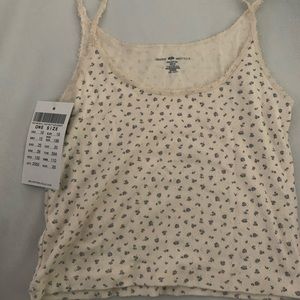 brandy melville white tank with blue flowers